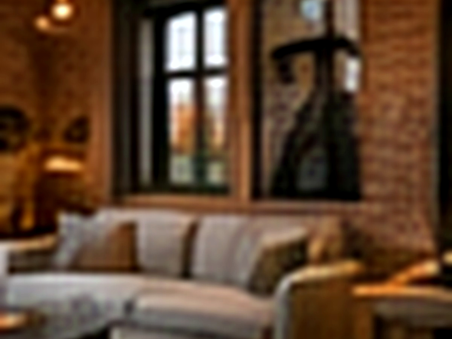 Pencere önünde oturma alanı ve şehir manzarası bulunan Deluxe Loft